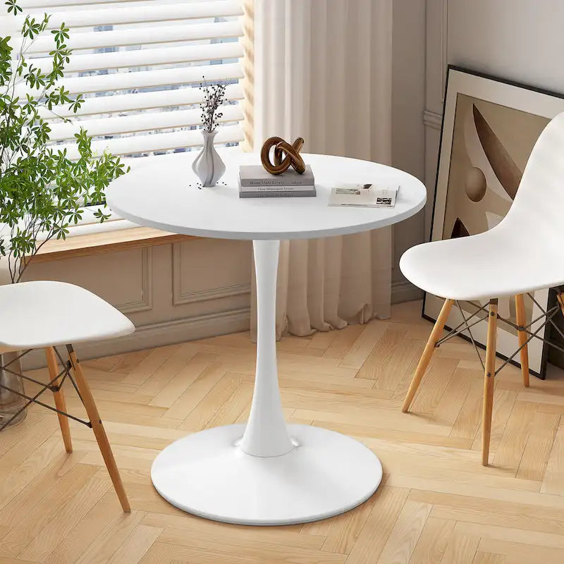 Tavolo da pranzo moderno con piano rotondo e base in metallo